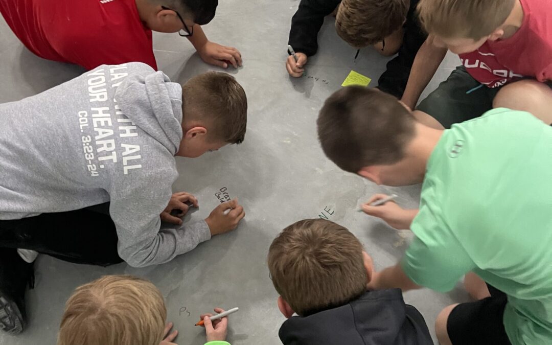 Christ Lutheran Students Imprint Their Legacy on the Foundation of Their Future Gym